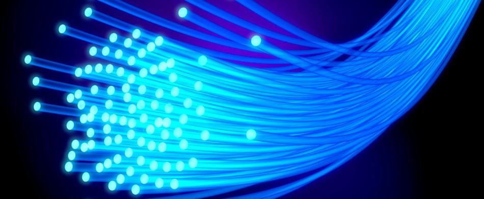 a bundle of glowing blue fiberoptic cables